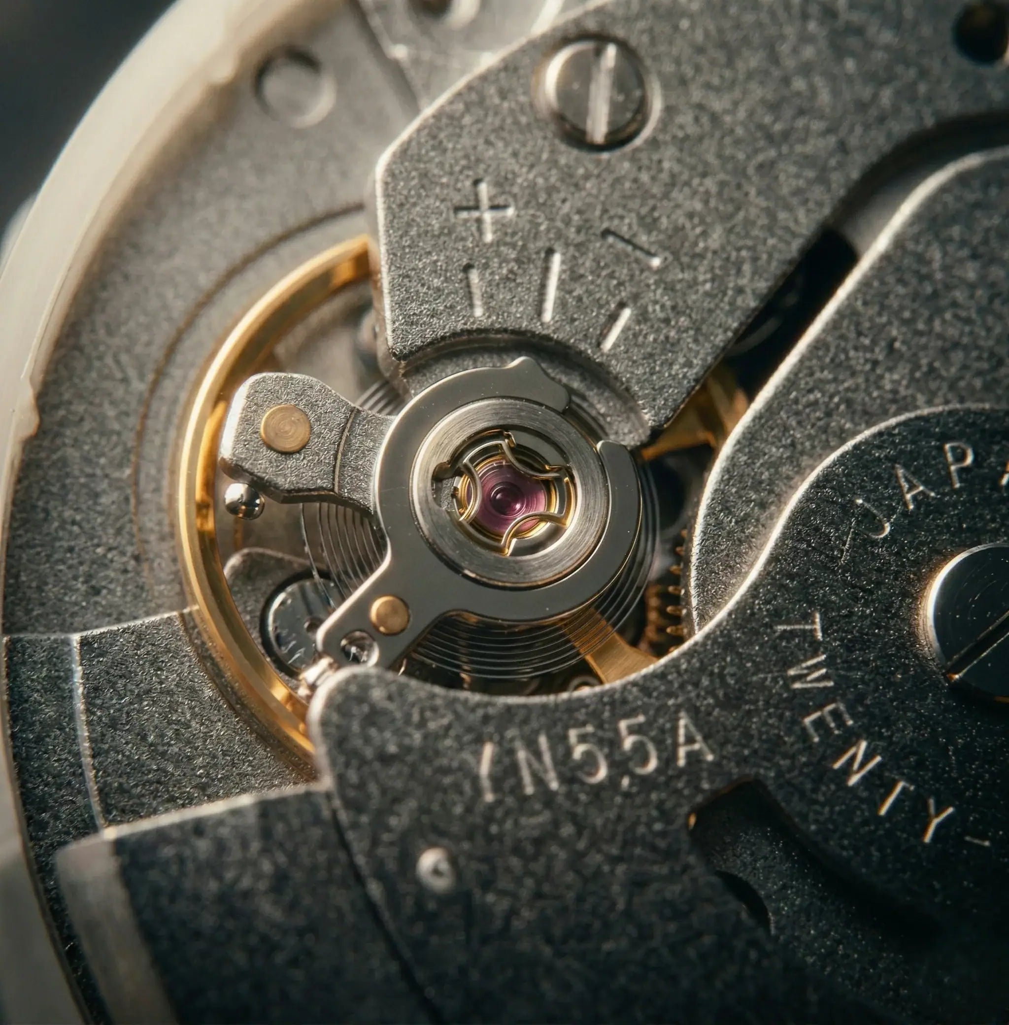 Macro of mechanical watch Sempra with detailed watch movement and gears visible.
